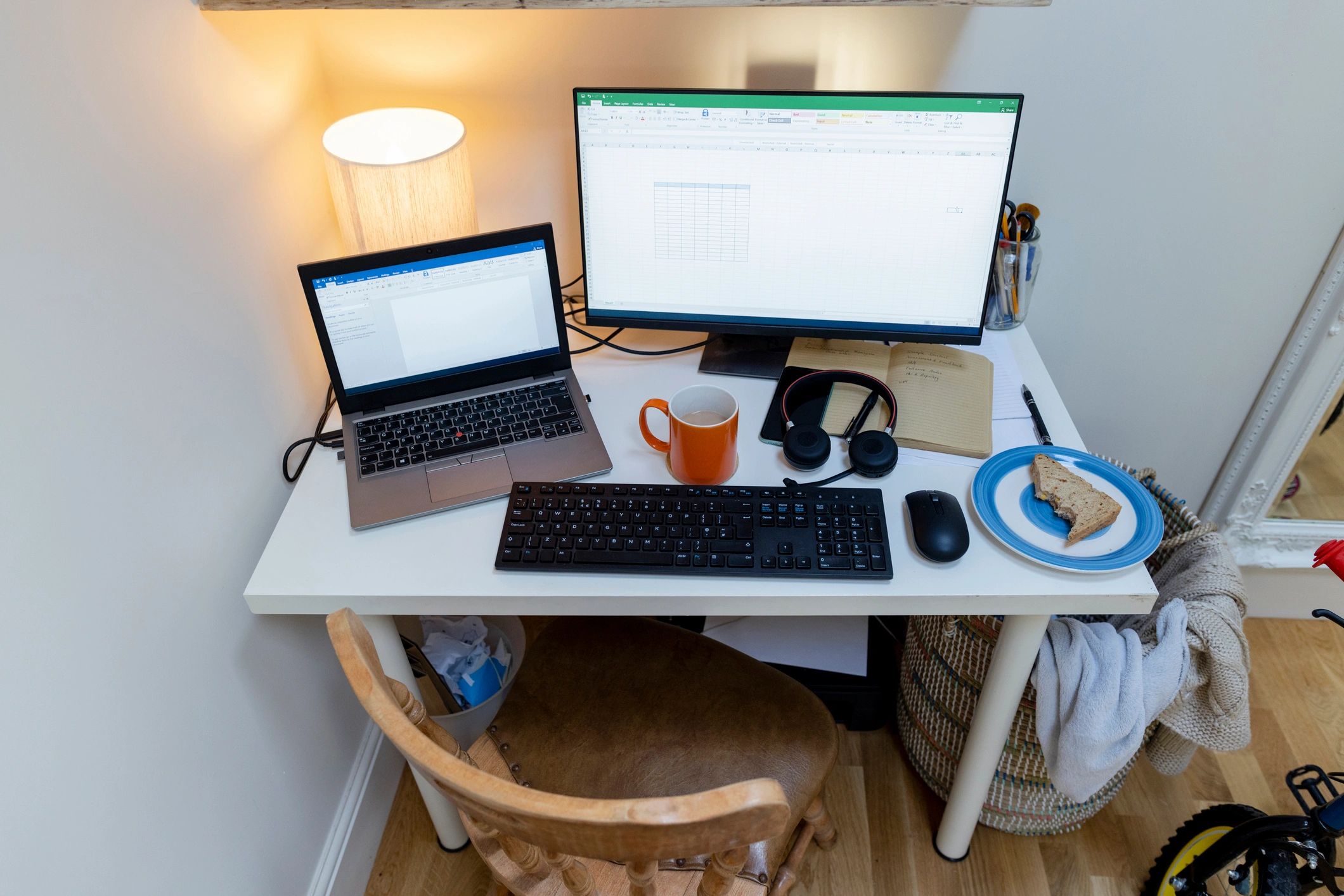 Editorial desk with computer monitors and documents